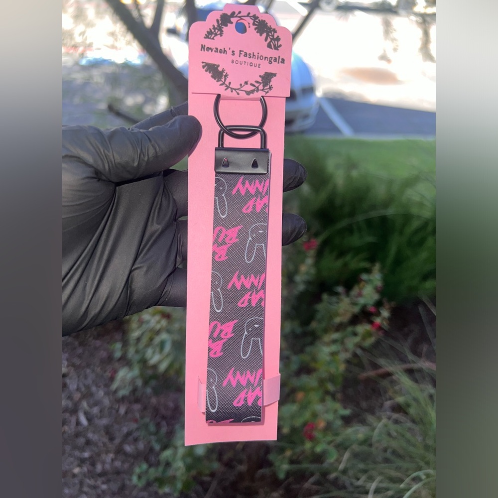 01: bad bunny black and pink key chain with glitter black on the inside
